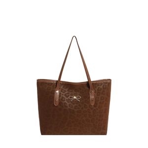 Classic leopard print suede tote bag with brown textures and gold bow detail