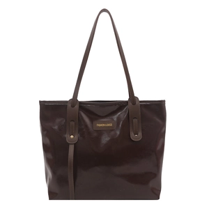 Brown high-capacity faux leather tote bag with polished finish and shoulder straps