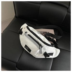 Detail of white sports waist bag with waterproof nylon fabric and reflective strip
