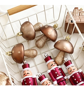 Detail of mushroom and nutcracker Christmas ornaments in a white wire basket