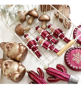 Detail of Christmas nutcracker soldier and mushroom ornaments in a vintage basket