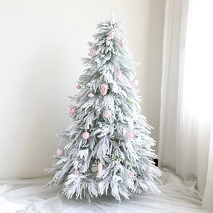 Realistic 1.8m snow-flocked Christmas tree decorated with elegant pink ornaments