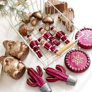 Nutcracker and mushroom Christmas ornaments set in a white basket with festive greenery