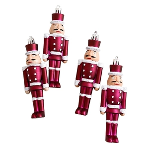 Set of four rose red nutcracker soldier Christmas tree ornaments with white glitter