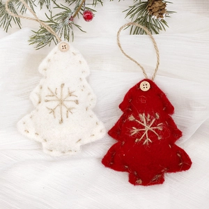 Handmade wool felt Christmas tree ornaments with embroidered snowflakes and wooden buttons