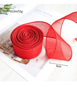 Detailed macro view of 5cm red mesh faux linen ribbon roll with grid texture for crafts