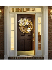 Detail of rustic burlap wreath with yellow plaid bows and daisy on a wooden door