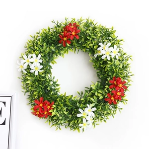 Spring wreath with green eucalyptus leaves and red and white flowers for front door decor