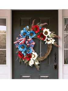 Close-up of patriotic wreath with red white and blue sunflowers on rustic wooden door