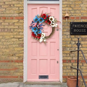 Independence Day wreath with red white and blue sunflowers and star ribbon on pink door