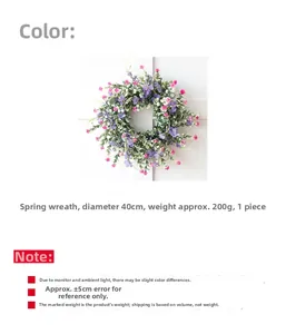 Detail showing artificial spring wreath with purple wildflowers and green leaves, 40cm diameter
