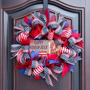 Patriotic July 4th front door wreath with Happy 4th of July sign and star patterns