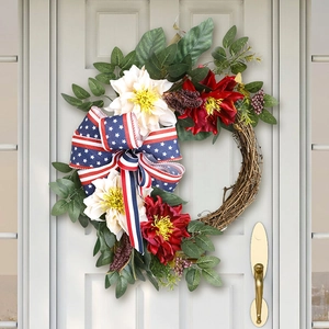 Close-up of patriotic July 4th wreath with red white flowers and star-spangled bow