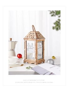 Macro detail of wooden Christmas lantern with rope handle and snowflake patterns