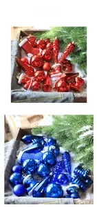 Detail of red and blue Christmas ornaments including stars and boots on pine branches