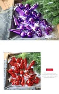 Detail of red and purple Christmas ornaments with glitter and electroplated finishes