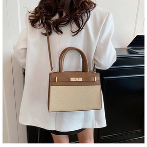 Chic brown leather and beige woven crossbody bag worn with a white blazer