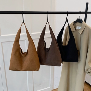 Minimalist faux suede tote bag in caramel, brown and black for winter casual style