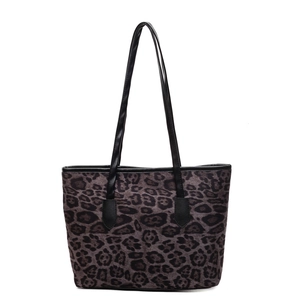 Classic dark leopard print tote bag with long black leather shoulder straps for women