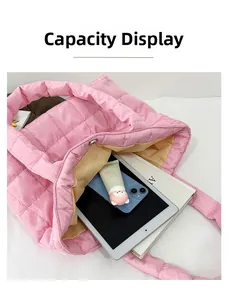 Interior view showing the large capacity and pink quilted fabric of the padded tote bag