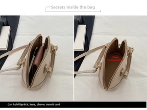 Detail showing high capacity shell bag with compartments for phone and wallet