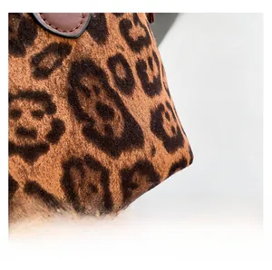 Macro shot of leopard print dumpling bag showing high-density faux fur texture and pattern