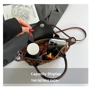 Detailed interior view of leopard print nylon tote showing spacious capacity for daily items