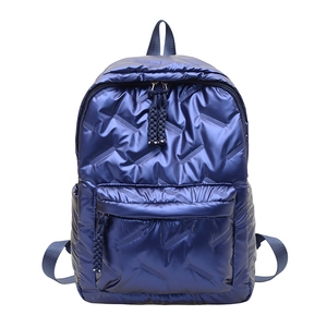 Minimalist metallic blue quilted backpack with large capacity and geometric texture design