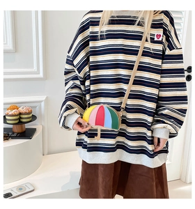 Detail of colorful umbrella-shaped crossbody bag with multi-color splicing and slim strap