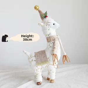 Detail of 38cm Christmas alpaca plush with gold polka dots and festive burlap hat