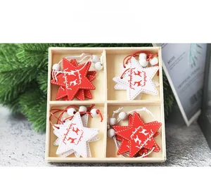 Star-shaped wooden Christmas pendants with reindeer patterns in a four-grid wooden box