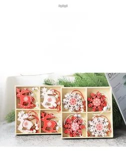 Detailed view of red and white wooden Christmas reindeer and snowflake ornaments in a box
