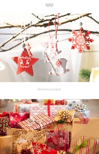 Close-up of bohemian wooden Christmas ornaments with red stars and white reindeer motifs