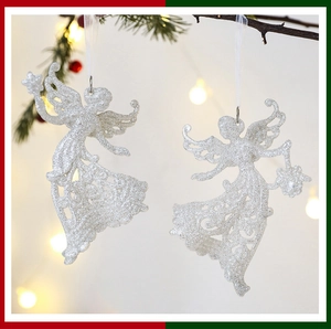 Close-up of glittery white angel tree ornaments with intricate hollowed patterns