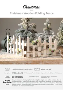 Détail de la clôture de Noël en bois blanc ornée de branches de pin et de baies rouges