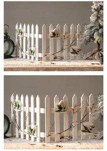Détail de clôture de Noël en bois blanc avec nid d'oiseau artificiel et décorations