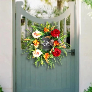 Floral wreath with 'blessed' sign and leopard bow on green wooden door decor
