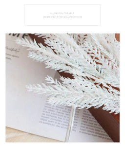 White glitter artificial plant branch for Christmas wreaths and holiday decoration