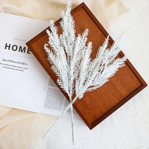 Two pieces of white glittery artificial PE branches for festive Christmas wreath decoration