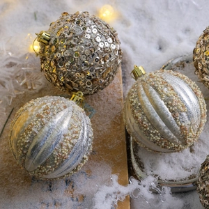 Golden sequined and pearl beaded Christmas ball ornaments for festive tree decoration