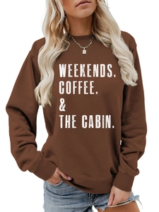 Detail of the white lettering print on a dark brown crew neck cotton blend sweatshirt
