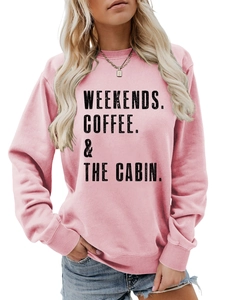 Close-up of the light pink crewneck sweatshirt featuring Weekends Coffee cabin print