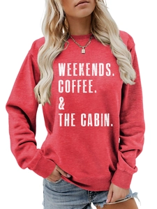 Detail of red crewneck sweatshirt featuring white WEEKENDS COFFEE & THE CABIN text print