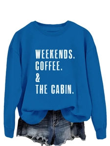 Flat lay of royal blue crewneck sweatshirt featuring white weekends coffee cabin print