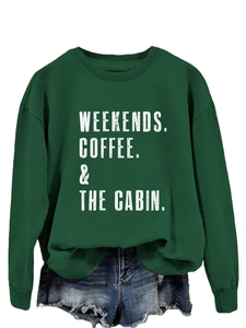 Detail of dark green sweatshirt with white Weekends Coffee and Cabin print and ribbed cuffs