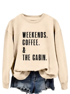 Flat lay of cream slogan sweatshirt and distressed denim shorts on white background