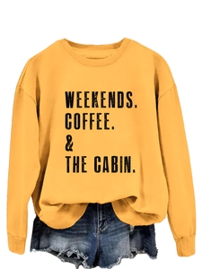Detail of ginger crewneck sweatshirt with WEEKENDS COFFEE & THE CABIN black print