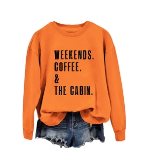 Orange crewneck sweatshirt with WEEKENDS COFFEE print paired with blue denim shorts