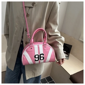 Close-up of pink and white Boston bag with number 96 print and adjustable strap