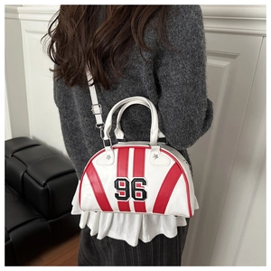 Back view of model wearing a vintage white bowling bag with red stripes and number 96
